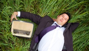 man listening music in a retro radio. man listening music in a retro radio.